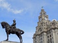 Edward VII statue with Liverpool Liver building Royalty Free Stock Photo