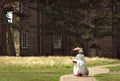 Edwardian Lady In Front Of Stately Home Royalty Free Stock Photo