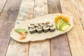 Eel and avocado maki with nori seaweed and wasabi with ginseng