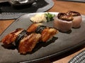 Eel nigiri and tuna sushi with fois gras in modern japanese restaurant