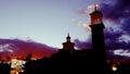 Eerie clouds at dusk as sunset bathes church spire in orange light