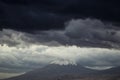 Eerie scenery of Biblical Mount Ararat with dark clouds above it