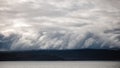 Eerie scenery of clouds over a field