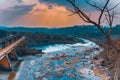 Eerie scenery of a river dam under sunlight