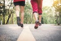 Eet man and woman running on the road for health Royalty Free Stock Photo