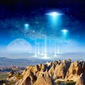 Eextraterrestrial aliens spaceship fly above surreal terrain