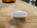 Amitriptyline Pill on wooden table concept