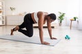 Effective bodyweight exercises. Curvy black woman making strength workout, running with her hands on floor at home