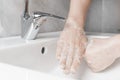 Effective handwashing techniques: rubbing each thumbs. Hand washing is very important to avoid the risk of contagion from