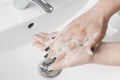 Effective handwashing techniques: woman wash her hands using palm to palm technique. Hand washing is very important to avoid the Royalty Free Stock Photo