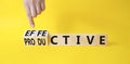 Effective and Productive symbol. Businessman Hand turns a cube and changes the word Productive to Effective. Beautiful yellow