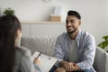 Effective psychotherapy. Happy middle eastern man talking to his psychologist, sharing therapy results with counselor Royalty Free Stock Photo