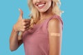 Happy Vaccinated Female Showing Shoulder With Patch And Thumbs Up Royalty Free Stock Photo