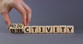 Effectivity and productivity symbol. Businessman turns cubes and changes the word productivity to effectivity. Beautiful grey