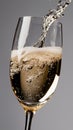 Effervescent champagne pouring into glass with bubbling celebration Royalty Free Stock Photo