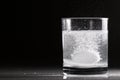 Effervescent pill in a glass of water Royalty Free Stock Photo