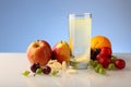 Effervescent soluble tablet of vitamins in a glass with water. Various fruits