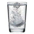 Effervescent tablet dissolving in a clear glass of water Royalty Free Stock Photo