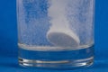 Effervescent tablet dissolving in a glass Royalty Free Stock Photo