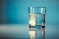 An effervescent tablet in a glass of water Royalty Free Stock Photo