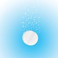 Effervescent tablet in water with bubbles on a blu Royalty Free Stock Photo