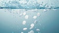 Effervescent tablets dissolving in carbonated water creating bubbles Royalty Free Stock Photo