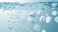 Effervescent tablets dissolving in carbonated water creating bubbles Royalty Free Stock Photo