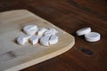 Effervescent tablets on wooden background