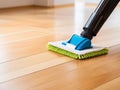 Efficient Floor Cleaning: Mop and Cleanser Foam Tips for Sparkling Parquet Floors. Royalty Free Stock Photo