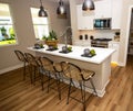 Efficient Kitchen With Island And Bar Stools Royalty Free Stock Photo