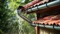 Efficient Rain Gutter Channeling Water Away. Concept Rain gutter maintenance, Downspout cleaning, Royalty Free Stock Photo
