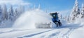 Efficient snow blower car effectively removes thick layers of snow to clear the road in winter