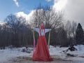 The effigy of Maslenitsa in Russian folk costume is burned in the snow during the traditional national holiday of mother Farewell