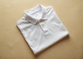 Effortless Elegance A CloseUp DocumentaryStyle Photography of a Crisp White Polo Shirt Against a Soft Cream Background Royalty Free Stock Photo