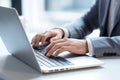 Productivity in Style: Businessman Typing on Laptop in Modern Office, close up hands