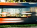 efocused tramway motion with large election posters with the chancellor