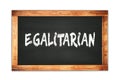 EGALITARIAN text written on wooden frame school blackboard Royalty Free Stock Photo