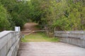 Egans Creek Greenway paths sometimes lead to wooden bridges which lead to more pathways Royalty Free Stock Photo