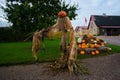 Egeskov, Denmark, Halloween: An orange pumpkin head with a smile and eyes carved from a pumpkin on the head of a stuffed Park