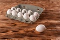 Egg on the background of egg packaging on a wooden table Royalty Free Stock Photo