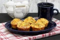 Egg, bacon and cheese breakfast muffins, close up in a breakfast setting Royalty Free Stock Photo