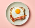 an egg and bacon sandwich on a plate on a pink background