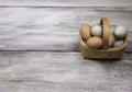 Egg basket on rustic background