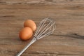 An egg beater, with two eggs Royalty Free Stock Photo