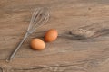 An egg beater, with two eggs Royalty Free Stock Photo