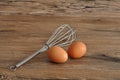 An egg beater, with two eggs Royalty Free Stock Photo