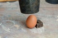 Egg being smashed or cracked with a hammer Royalty Free Stock Photo