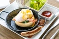 Egg benedict with bacon and sausage Royalty Free Stock Photo
