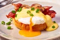 Egg Benedict with fried bacon and hollandaise sauce Royalty Free Stock Photo