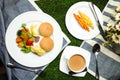 Egg Benedict slider with vegetable salad include tomato, potato, lettuce leaf and carrot with tea, coffee, and sweet melon served Royalty Free Stock Photo